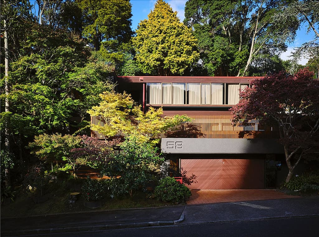 The 1970s home has serious curb appeal thanks to its stepped silhouette and terraced gardens