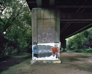 A graffiti-covered concrete column