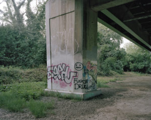 A graffiti-covered concrete column