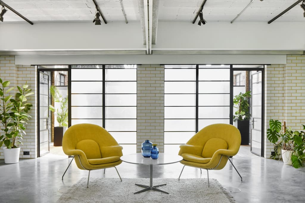 Glazed bricks, steel supports and crittal glass hark back to the building's origins as a garage and service station for cars in the 1930s
