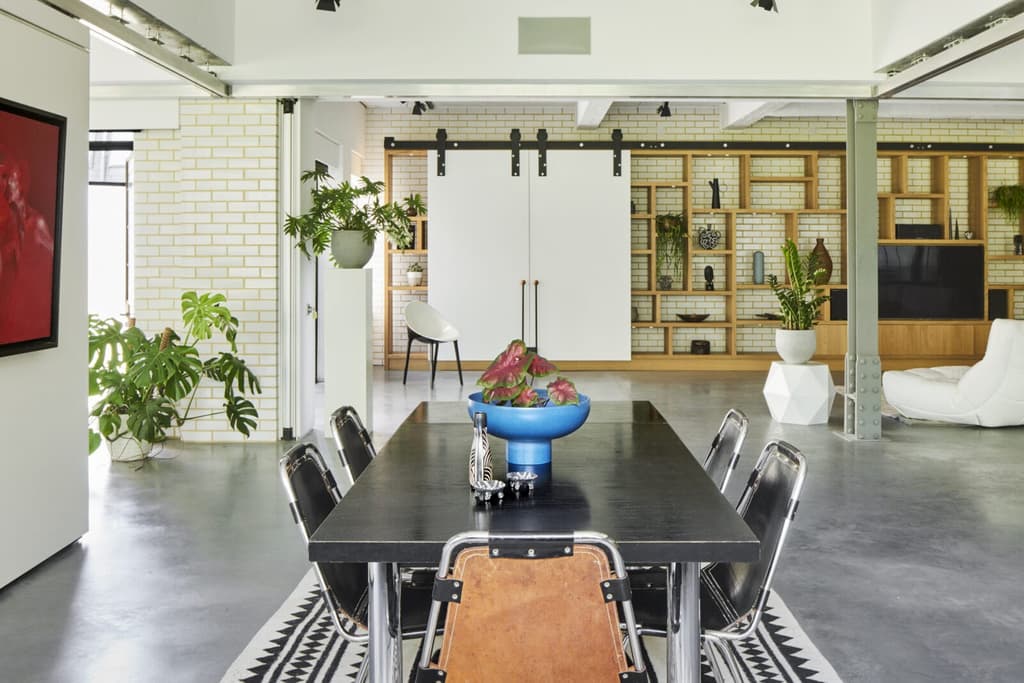 Polished concrete floors run across the apartment which retains an open and adaptable floorplan courtesy of moveable walls