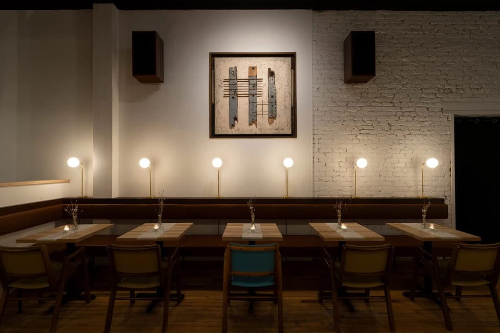 Artworks were created for the space by a local designer, using reclaimed materials discarded during the refurbishment