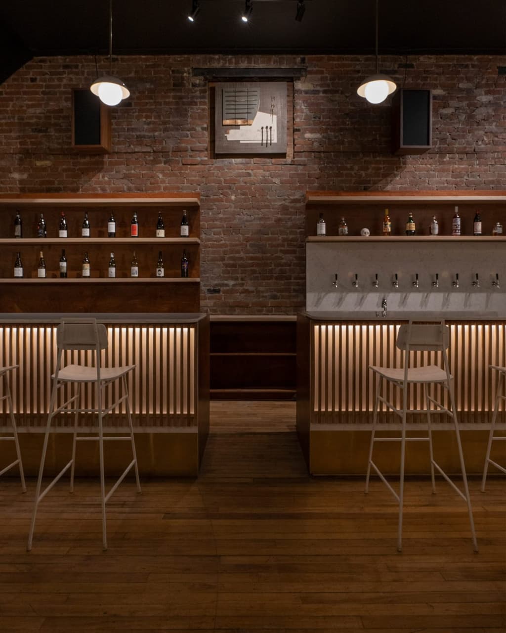 Exposed brick walls heighten the industrial feel inside the wine bar
