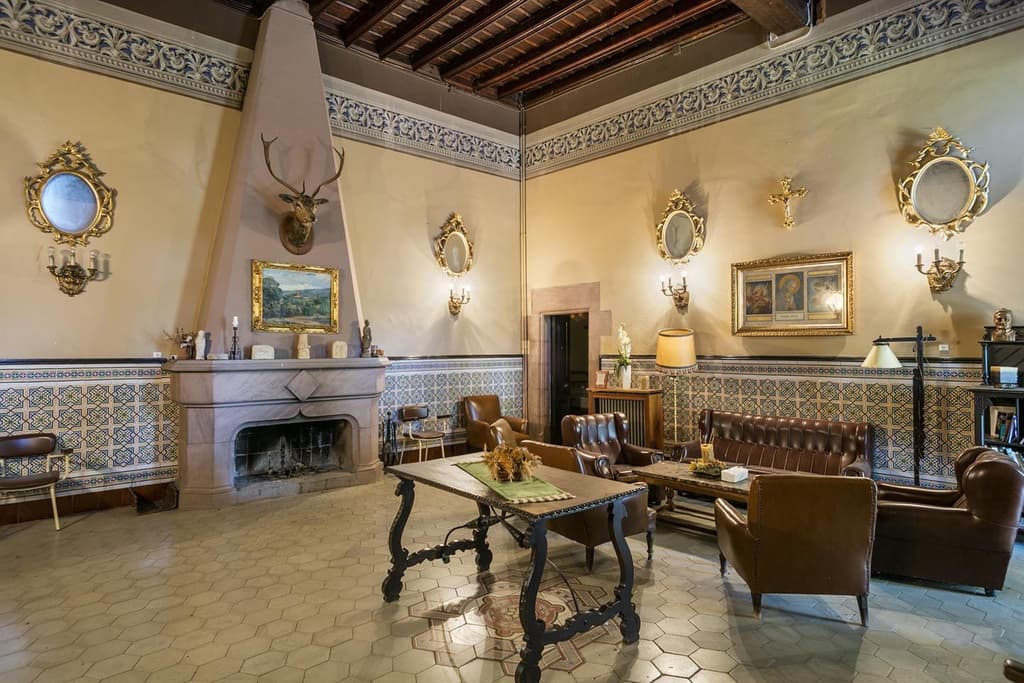 Interiors are unabashedly grand, featuring jaw-dropping stone fireplaces, traditionally blown stained-glass windows, mouldings and red stone doorjambs and lintels.
