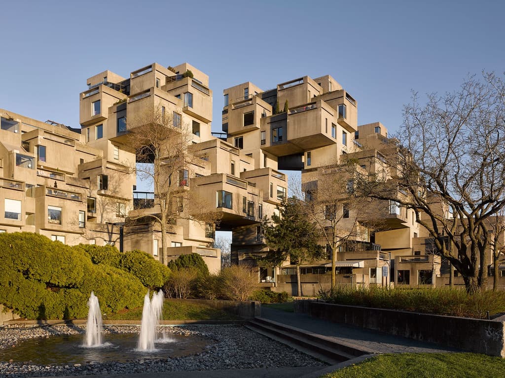 The futuristic form of Habitat 67 comprises stacked concrete cubes – each dwelling has its own outdoor space and unique view
