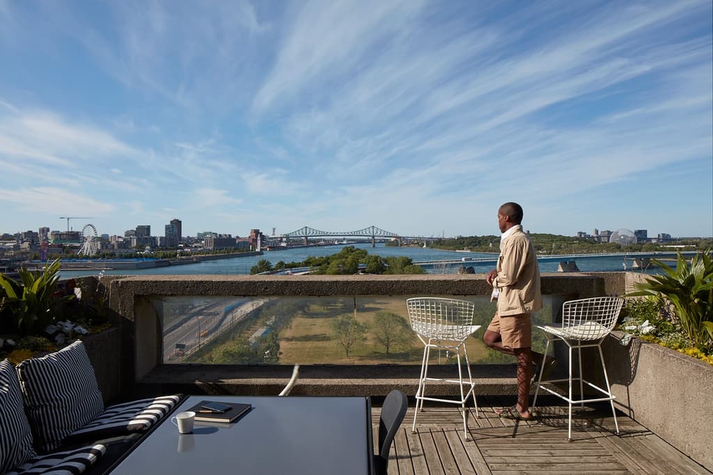 Byron looks out across the St Lawrence River from his garden terrace