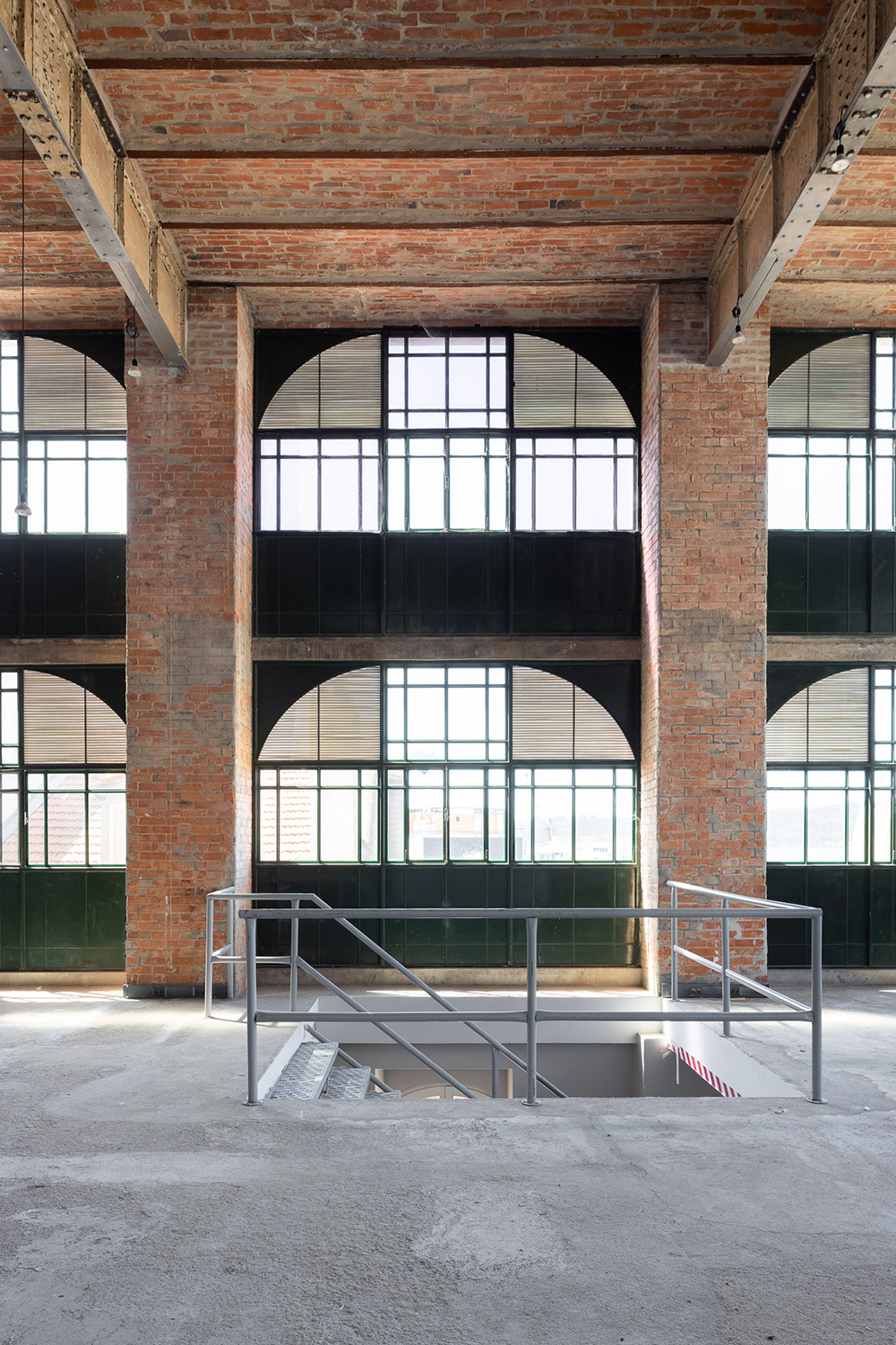 The vacant, south-facing warehouse dates from the early 20th-century and features rows upon rows of vaulted brick arches in its ceilings.