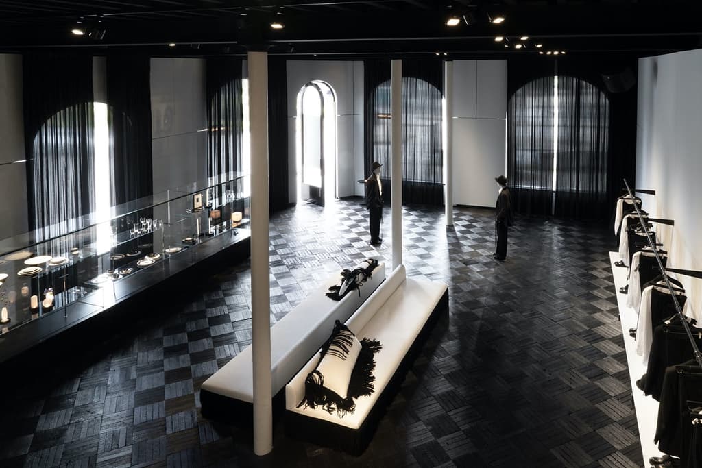 Demeulemeester’s husband, Patrick Robyn, designed the two-storey retail space, which fully embraces the label founder’s gothic reputation with its inky black floor and ceiling