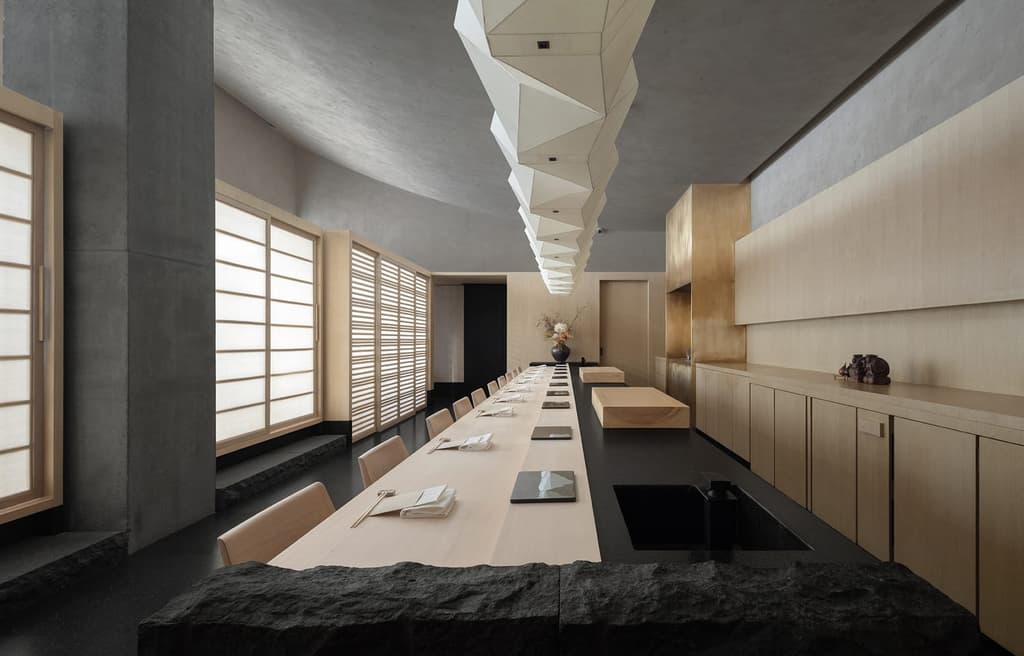 Origami lighting and rammed earth enliven this Shenzhen sushi restaurant