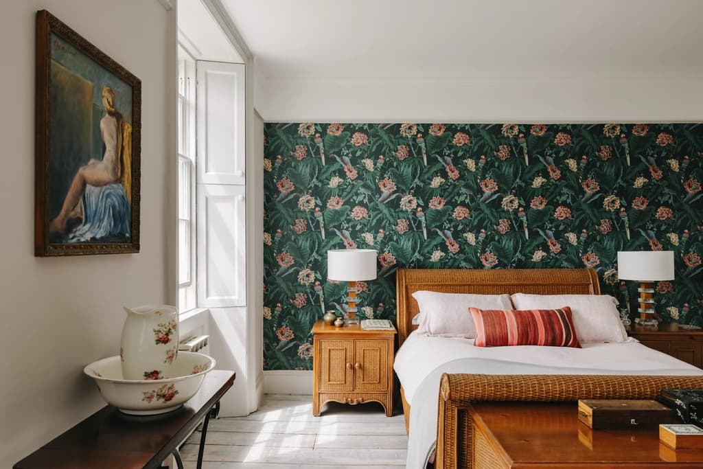 Restored plasterwork is the main ornamentation across its serene, chalk-coloured rooms, with patinated pine floorboards and fireplaces injecting warmth into the minimalist, lofty spaces.