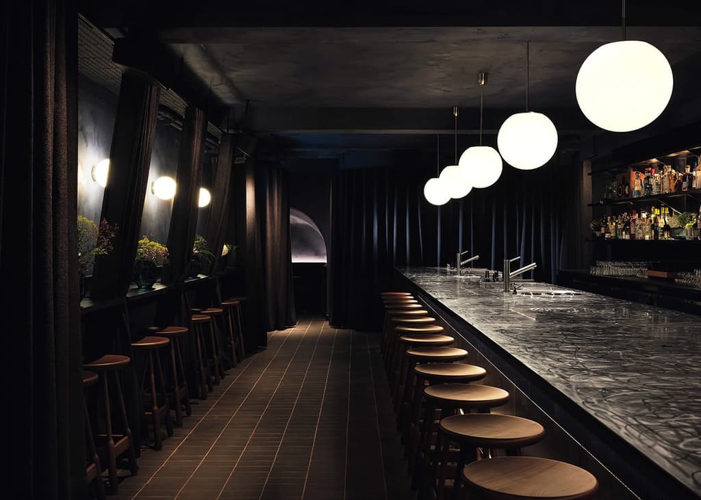 Lunar inspired hanging pendants set the tone for the nightscape interiors