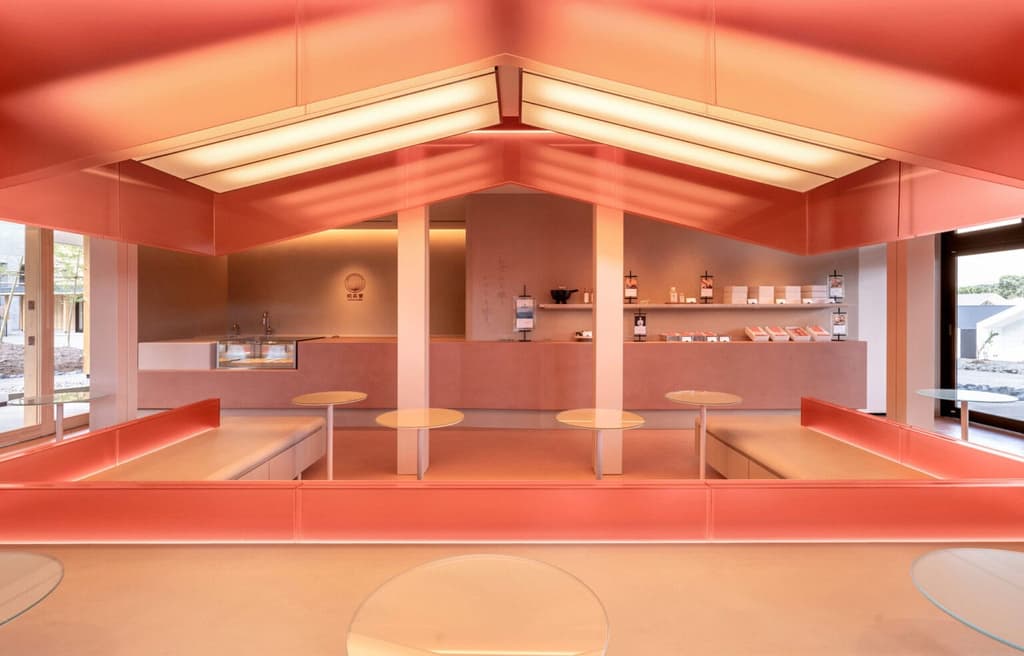 This Taki cafe welcomes guests with a diffused pink glow