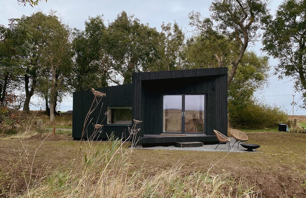 Trees at Tughall is a trio of minimalist cabins on England’s Northumbrian coast