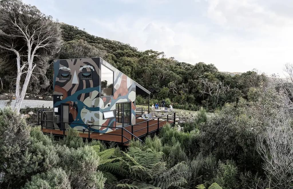 Jacky Winter Waters is a camo beach hut overlooking Australia’s Waratah Bay