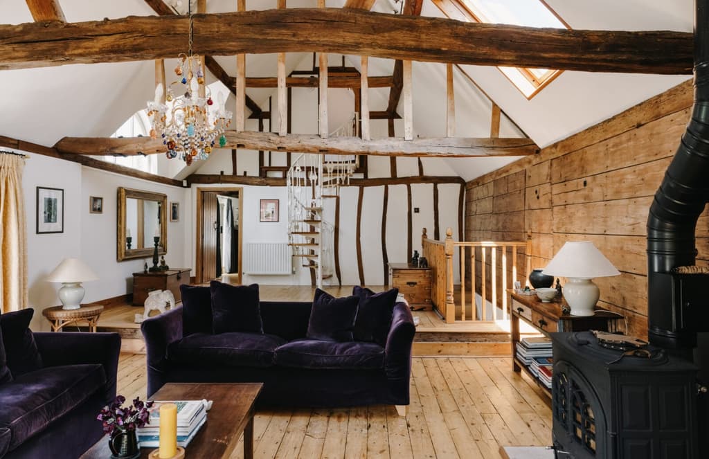 This converted coach house sleeps 10 under original wood beams
