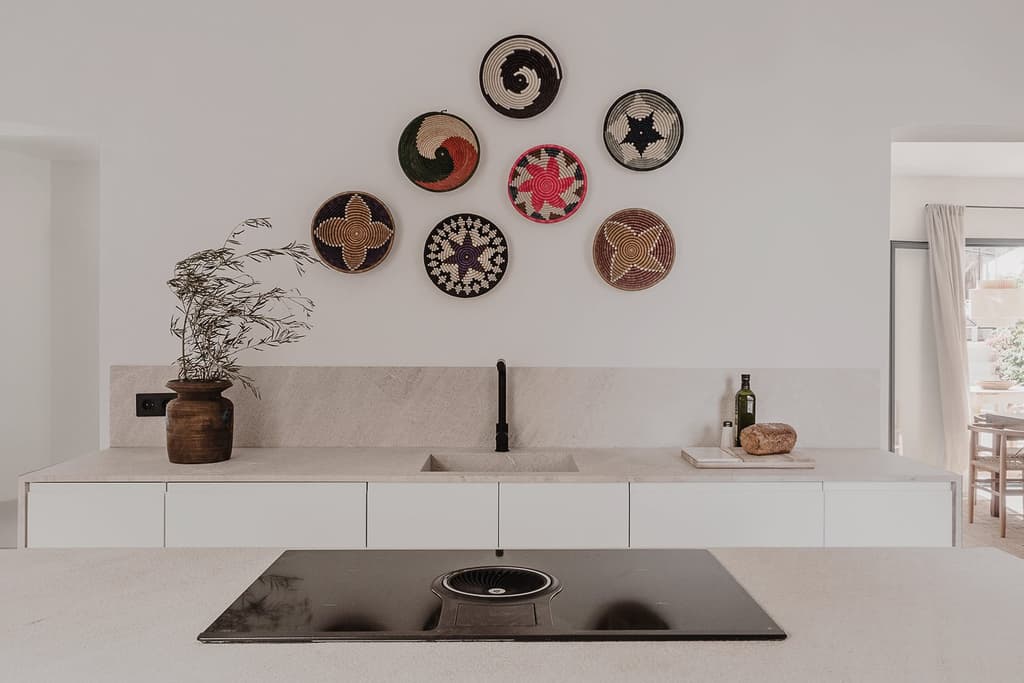 The kitchen has been modernised and features natural stone counters and a large island for cooking and food prep.