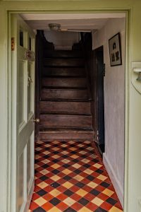 Plaid tiled flooring in the hallway