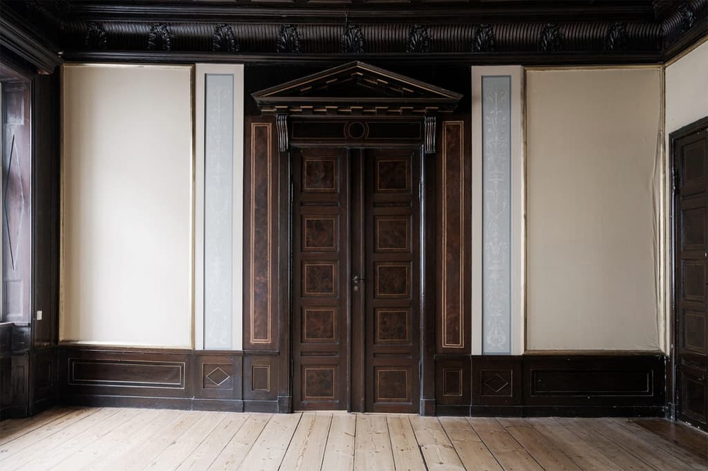 The first salon, featuring ornately carved woodwork