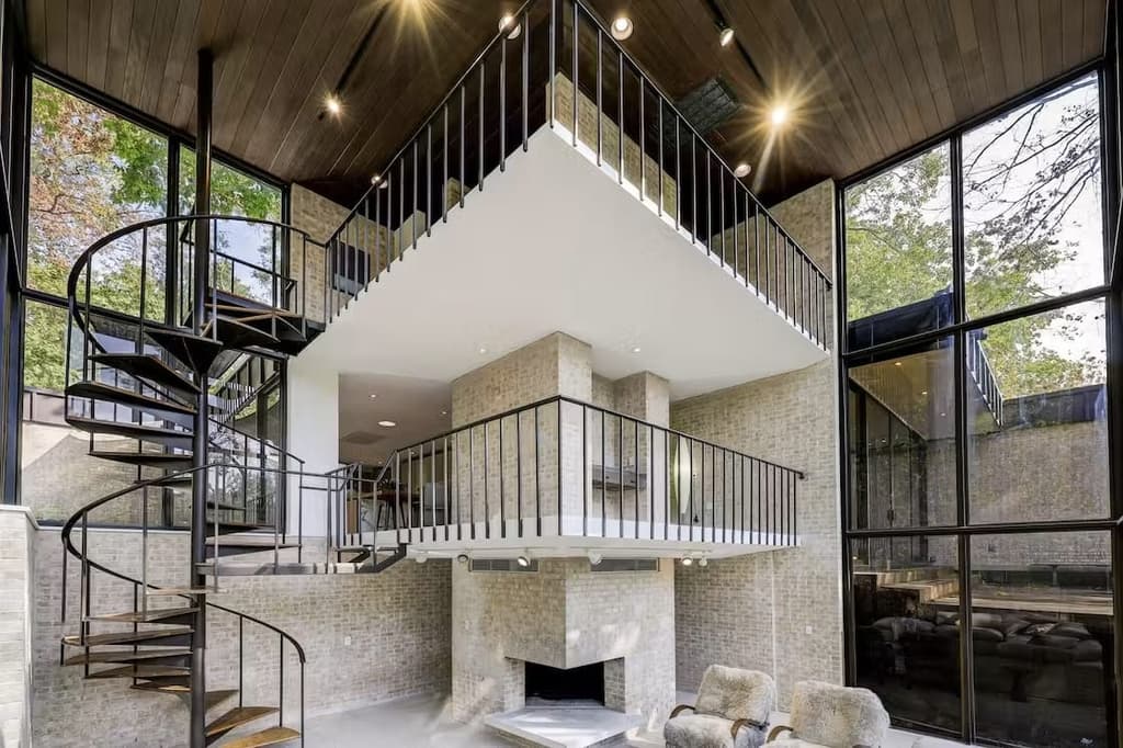 A colossal fireplace ascents three storeys of the property
