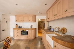 The kitchen has been modernised in keeping with the Georgian style of the rest of the home