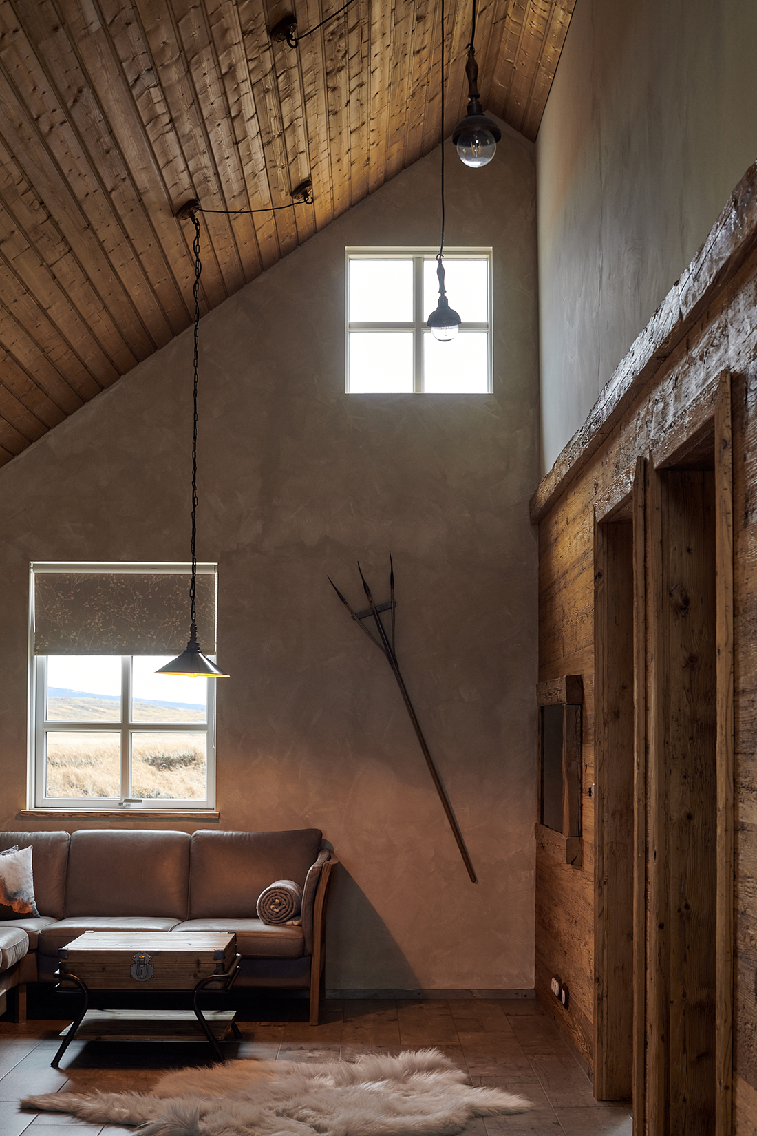 Interiors feature wood panelling and rafters made from reclaimed Austrian pine (Iceland famously has very few trees.) Photography: Louise Long (c)