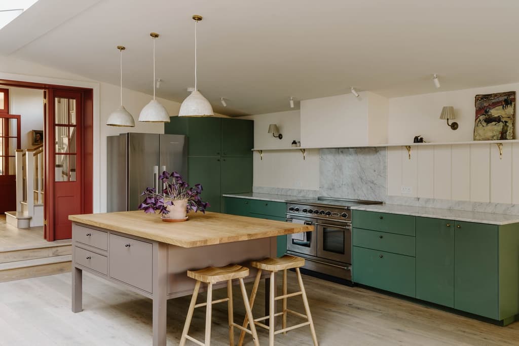 The Shaker style kitchen, with green cabinetry and red doors