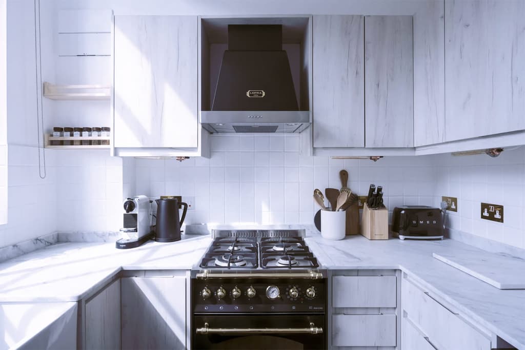 Kitchen with white Carrera marble counters