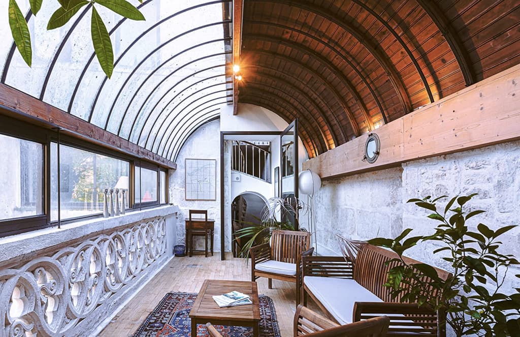 This French fixer-upper boasts a barrel-vaulted glass roof