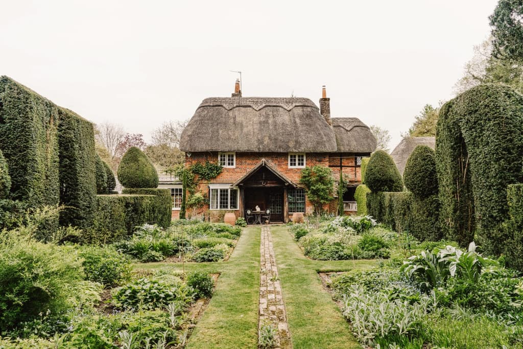 A country cottage beckons from beneath an enchanting thatched roof