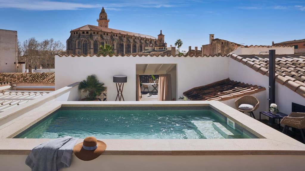 Rooftop swimming pool, backdropped by a neighbouring church