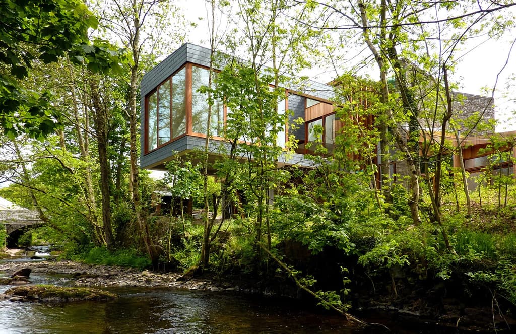 Inside a gravity-defying riverfront home in Wales