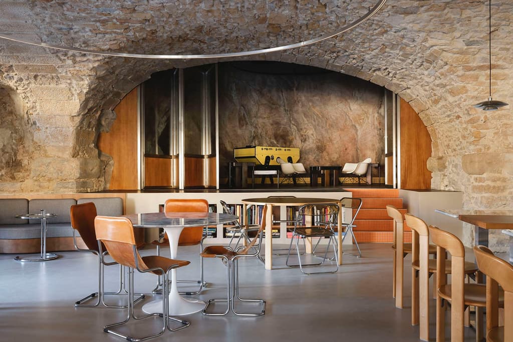 A new café on Lyon's riverfront bridges centuries of design heritage