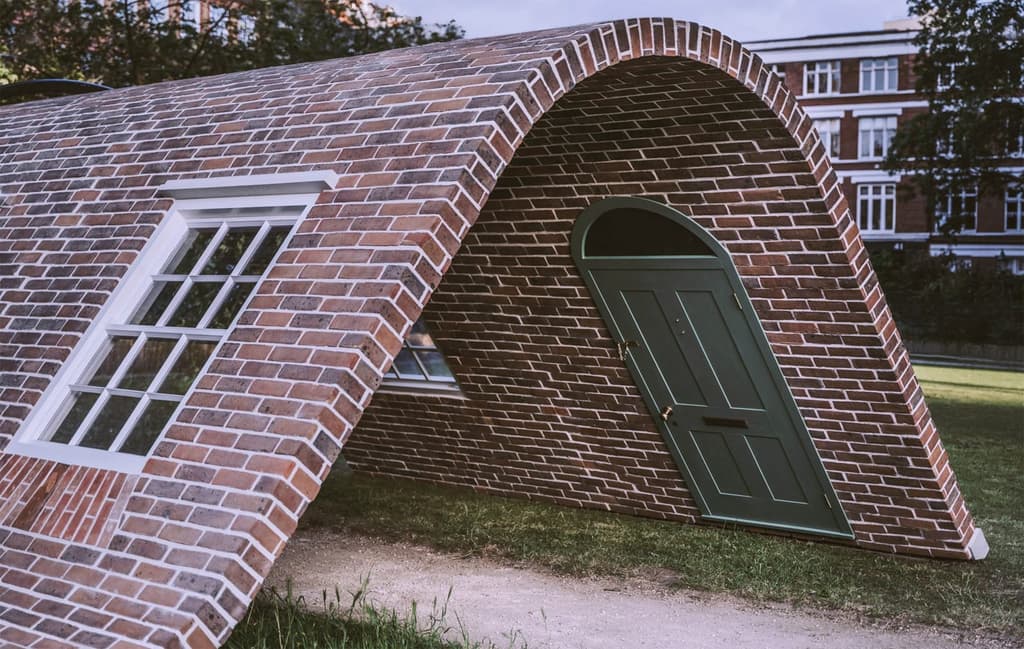 Curving brick sculpture by Alex Chinneck
