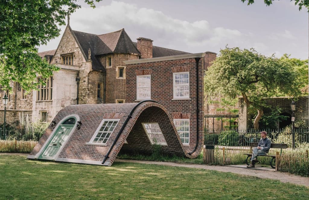 Alex Chinneck unveils a reclining facade in a London square