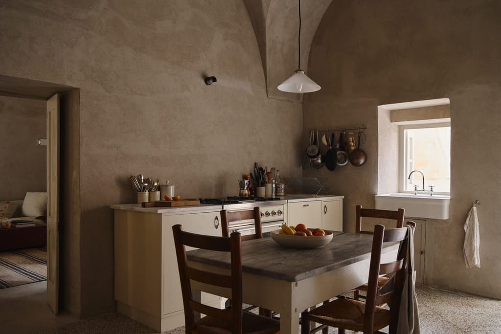 Kitchen with restored cabinetry and vaulted ceilings