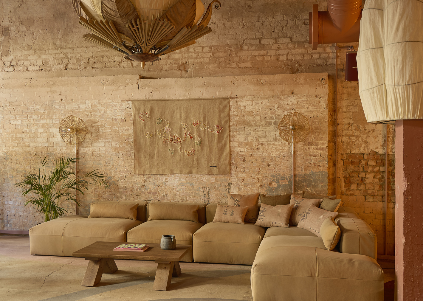 The lounge area has a n earth, soft, neutral vibe