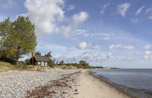 Buy a black timber summerhouse on the edge of the Baltic