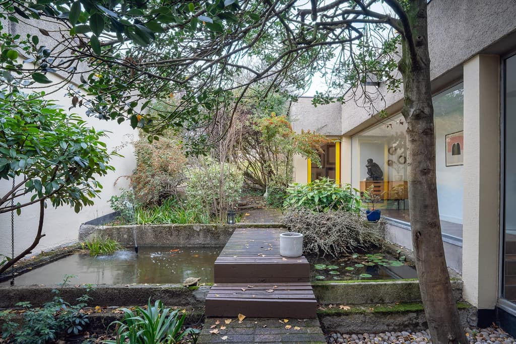 Picture yourself in this bohemian U-shaped house designed by Abraham & Rol