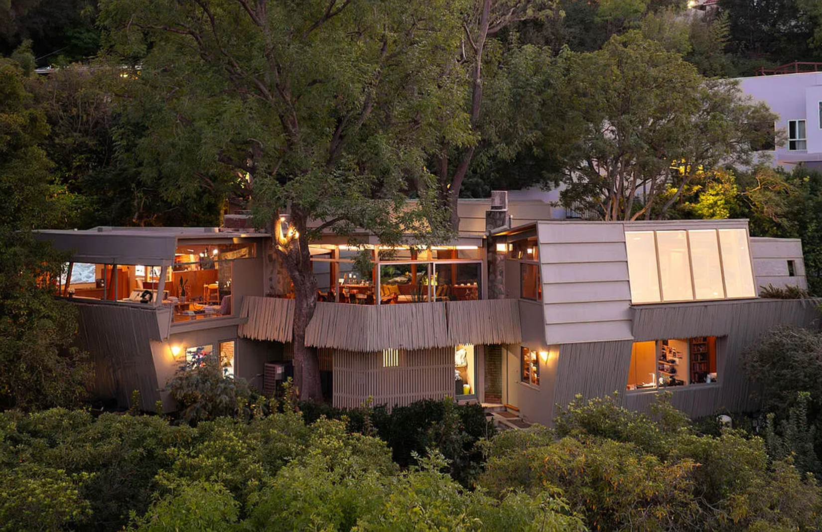 A Rudolph Schindler house with a trapezoidal roof hovers above the San Fernando Valley