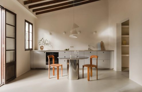 Steel, stone and timber converge inside this Mallorca apartment