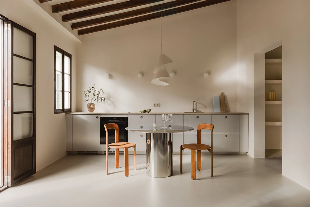 Steel, stone and timber converge inside this Mallorca apartment