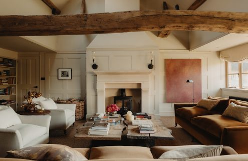 Exposed timber runs through this converted barn in the Cotswolds