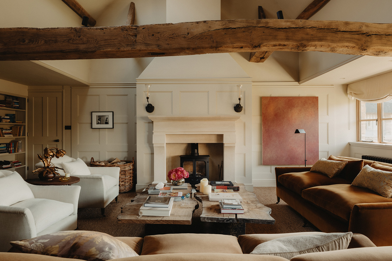 Exposed timber runs through this converted barn in the Cotswolds