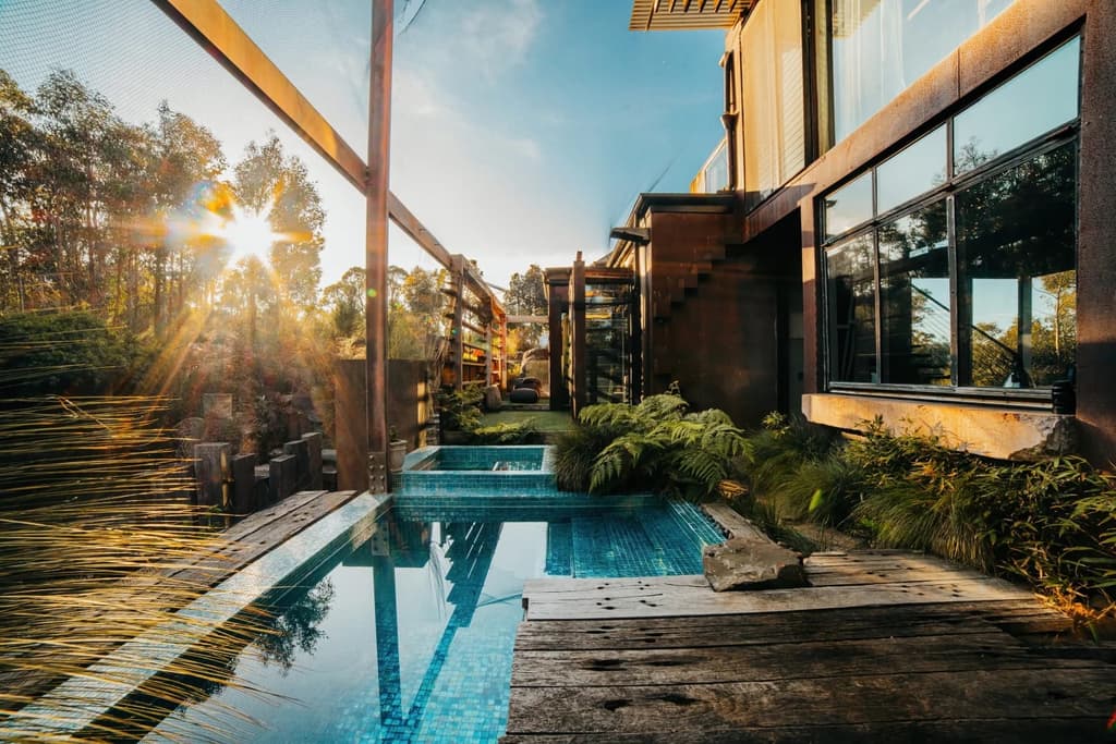 Water meets glass at this off-grid house in Australia's southeast
