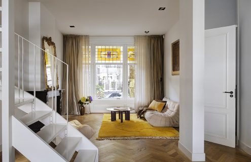 In east Amsterdam, a cool 20th-century townhouse is reworked with a wall of glass