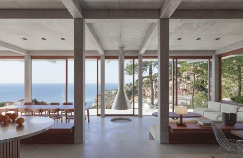 A concrete villa by Isla Architects overlooks the Balearic Sea