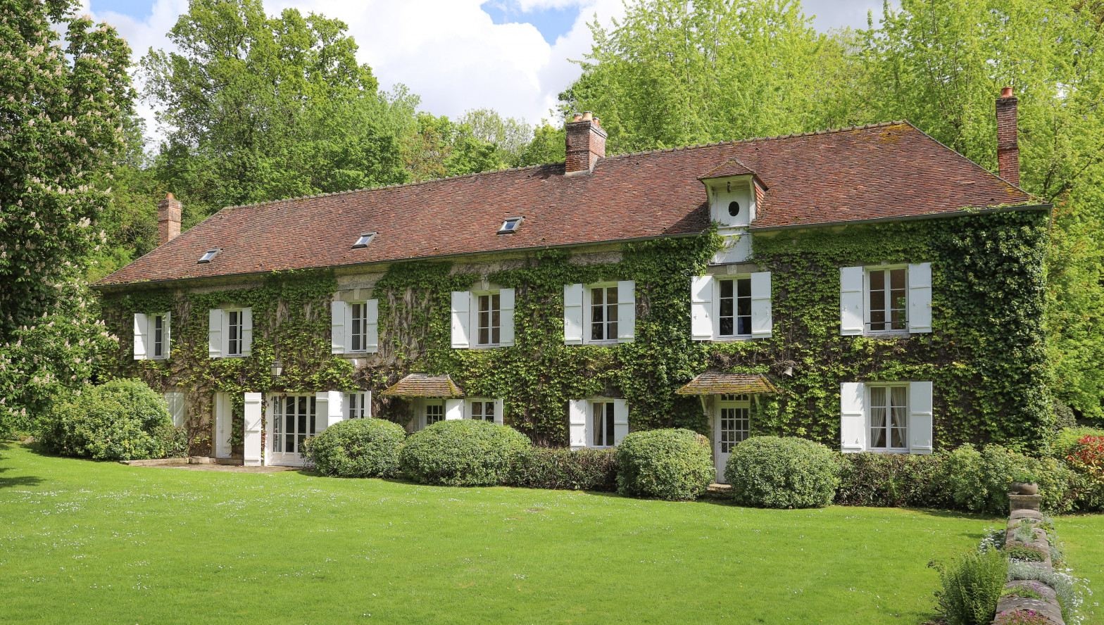 Tour this ivy-coated water mill, set within eight hectares of French countryside
