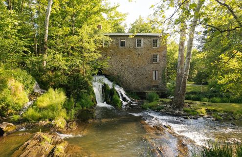 A waterfall runs beneath this Hudson Valley mill